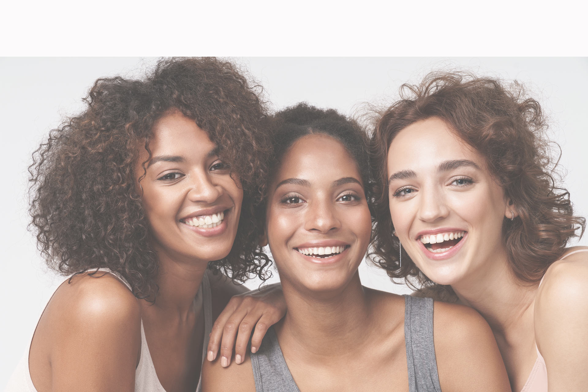 Three smiling sexually active women of child bearing age